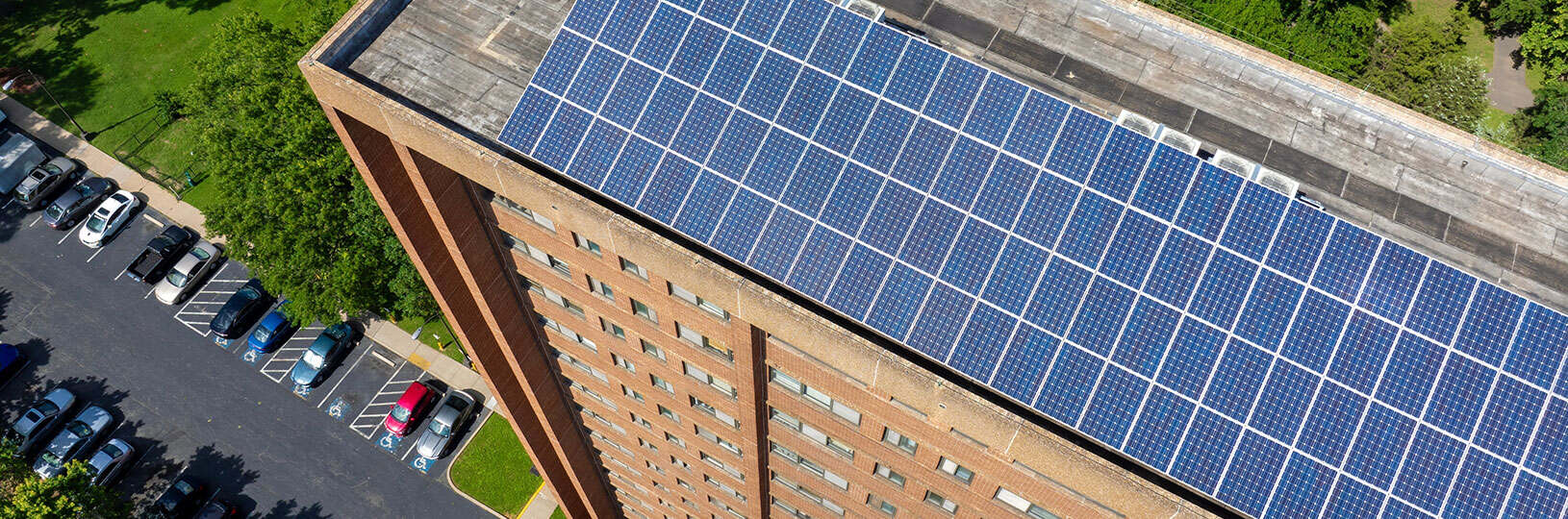 Aerial view of Residential apartment building with solar roof.