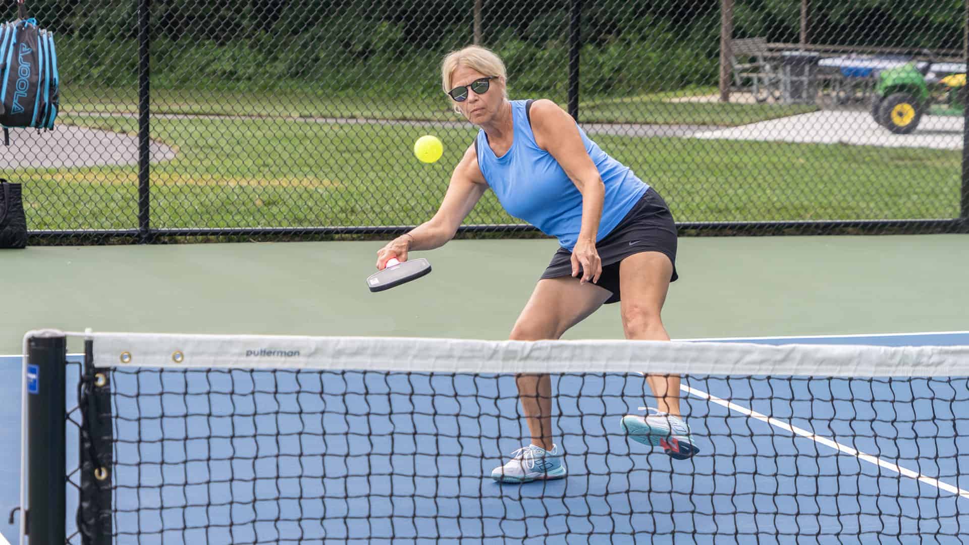 A woman playing pickleball at Lyon Oaks County Park.
