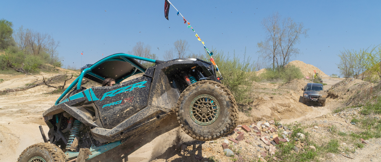 Off-road recreation vehicle climbing hills 