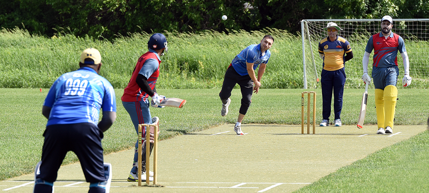 Men playing cricket at Lyon Oaks