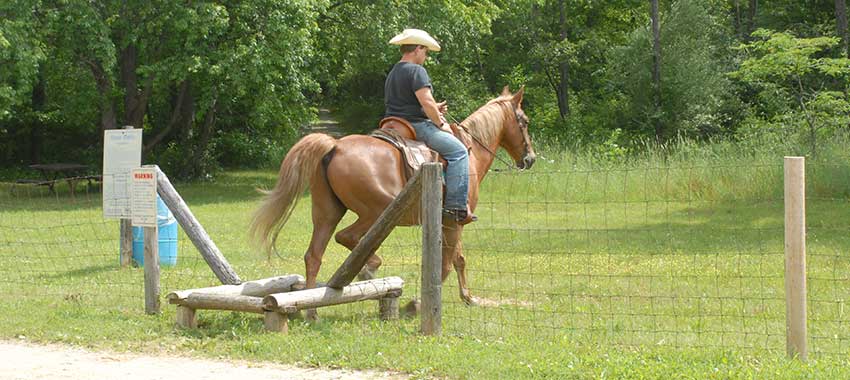 A man riding a horse at Rose Oaks