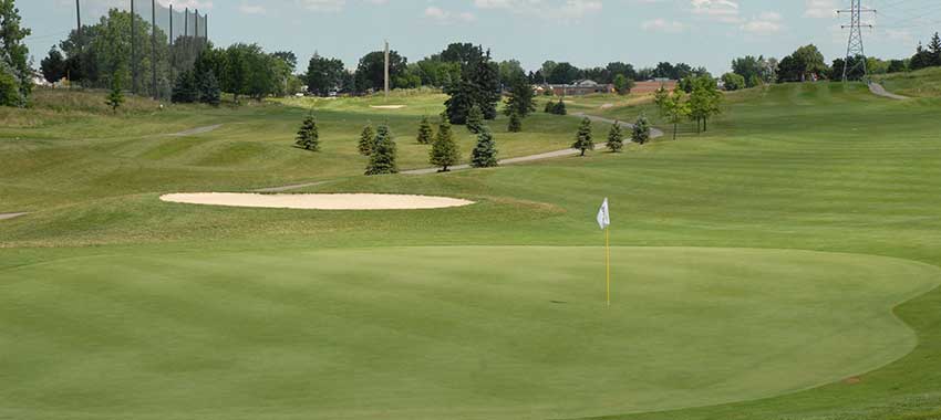 The green and fairway at Red Oaks Golf Course